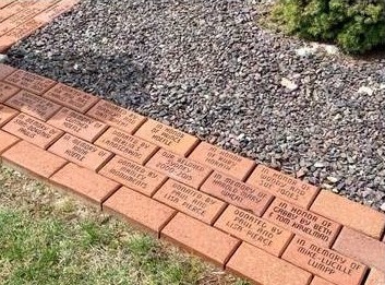 Engraved memorial bricks along the walkway